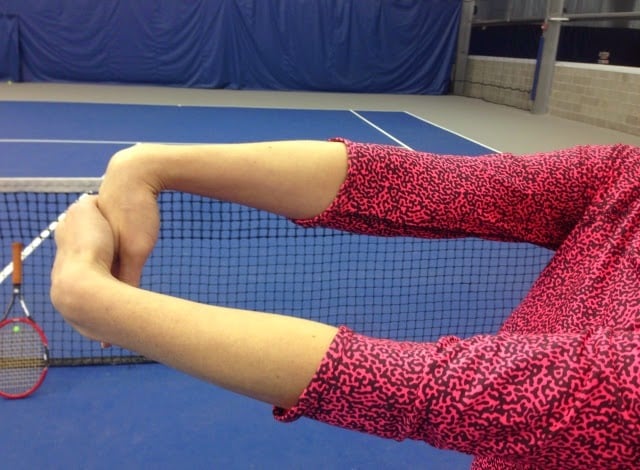 Forearm stretch for tennis warm-up