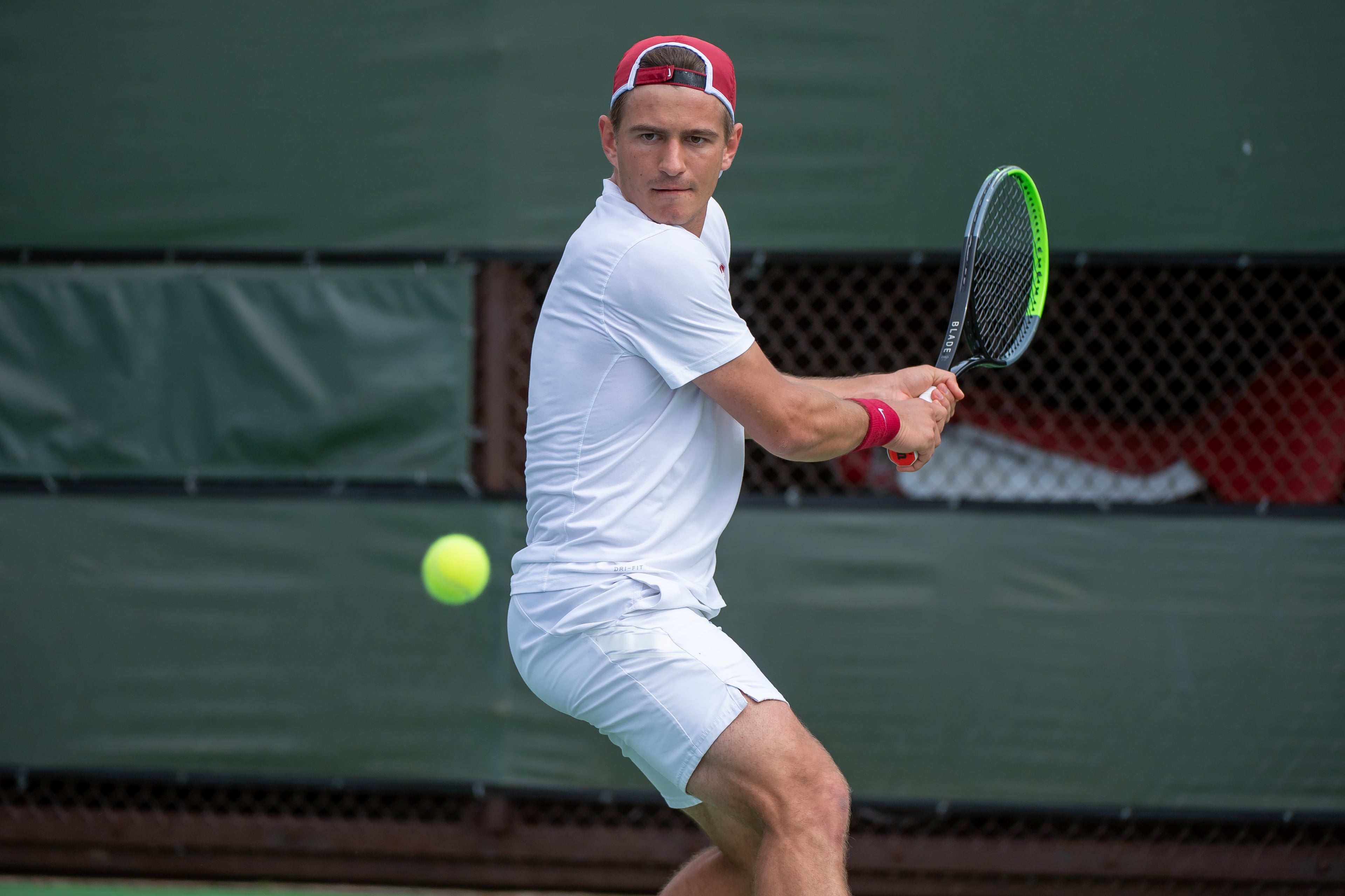 International college tennis player in action