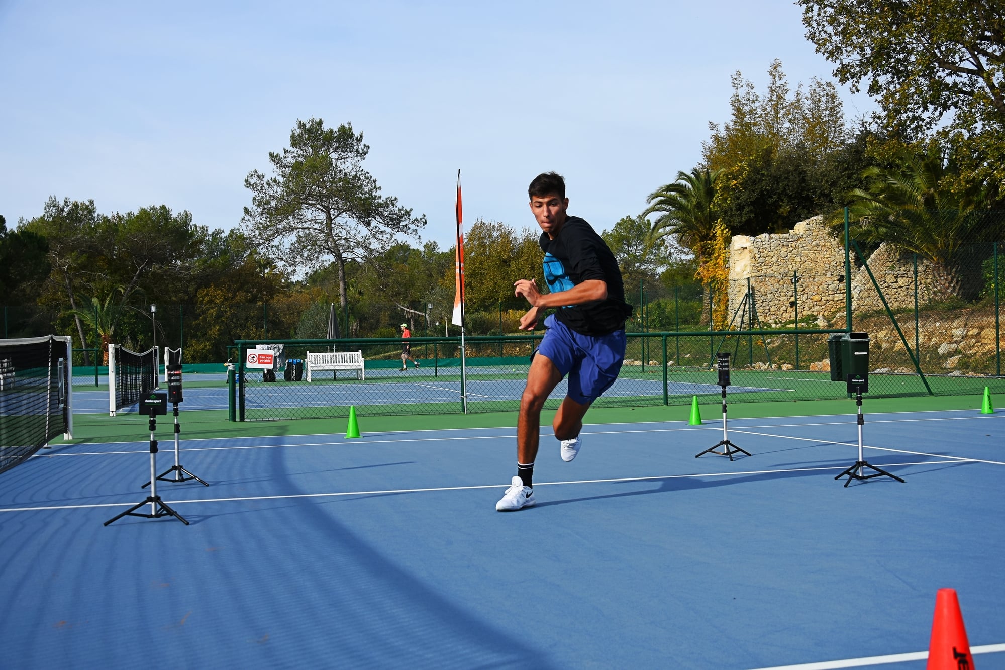 Tennis player demonstrating explosive footwork on court