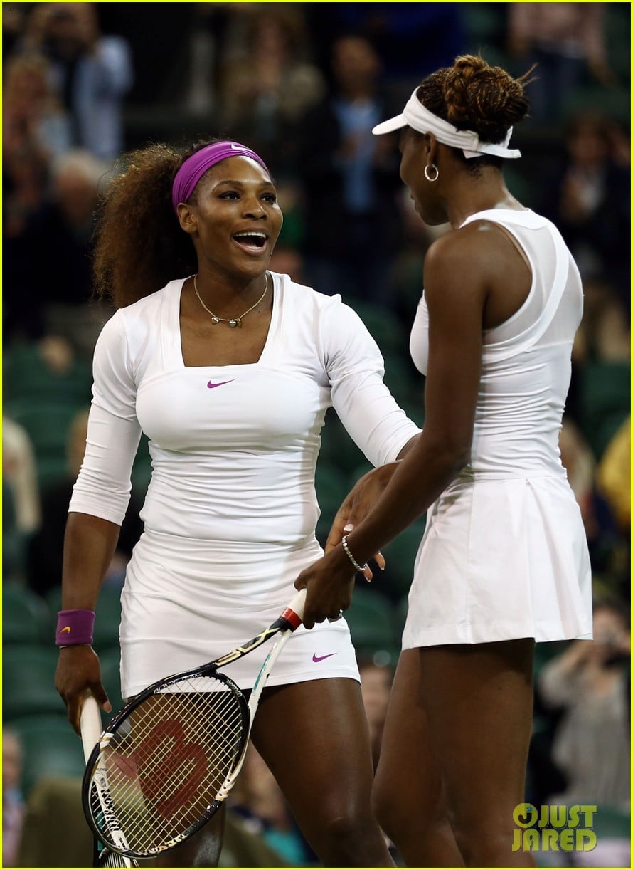 Venus and Serena Williams celebrating Wimbledon doubles victory